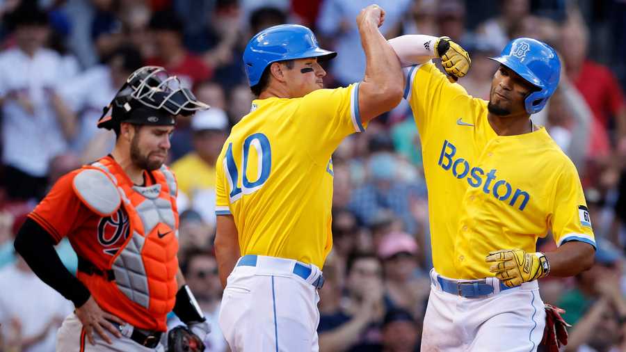 Boston Red Sox wearing yellow and blue uniforms for all three