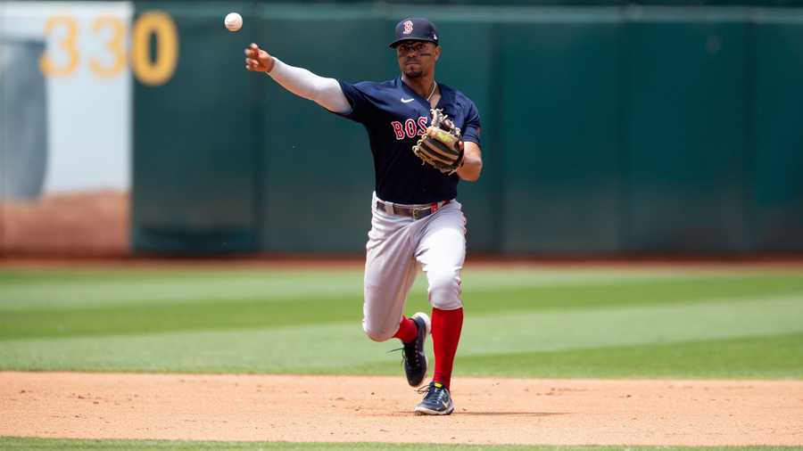Boston Red Sox shortstop Xander Bogaerts (2) throws to first in time to retire Oakland Athletics' Christian Bethancourt during the fourth inning of a baseball game, Sunday, June 5, 2022, in Oakland, Calif.