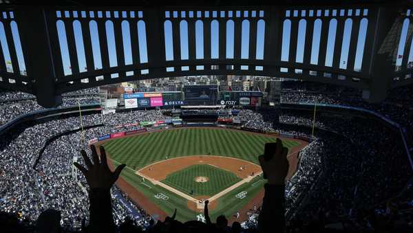 FILE - Fans react after New York Yankees' Aaron Judge hits a home run during the third inning of a baseball game against the San Francisco Giants at Yankee Stadium.