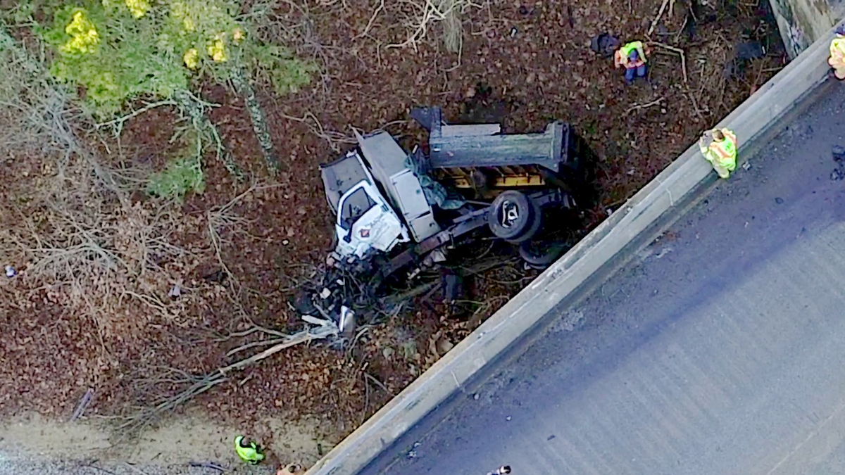 Truck crashes off Cape Cod overpass, lands on railroad tracks below