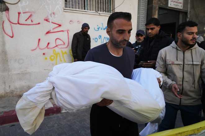 FILE - The body of 11-year-old Palestinian girl Hamsa Hosou, killed by Israeli fire in Jabalia, is brought to Shifa Hospital in Gaza City Thursday, Jan. 8, 2026.