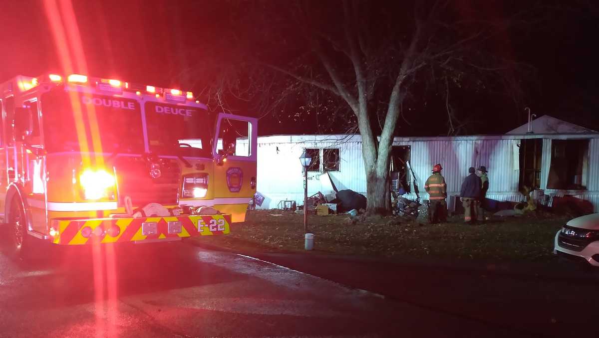 Woman rescued from mobile home fire