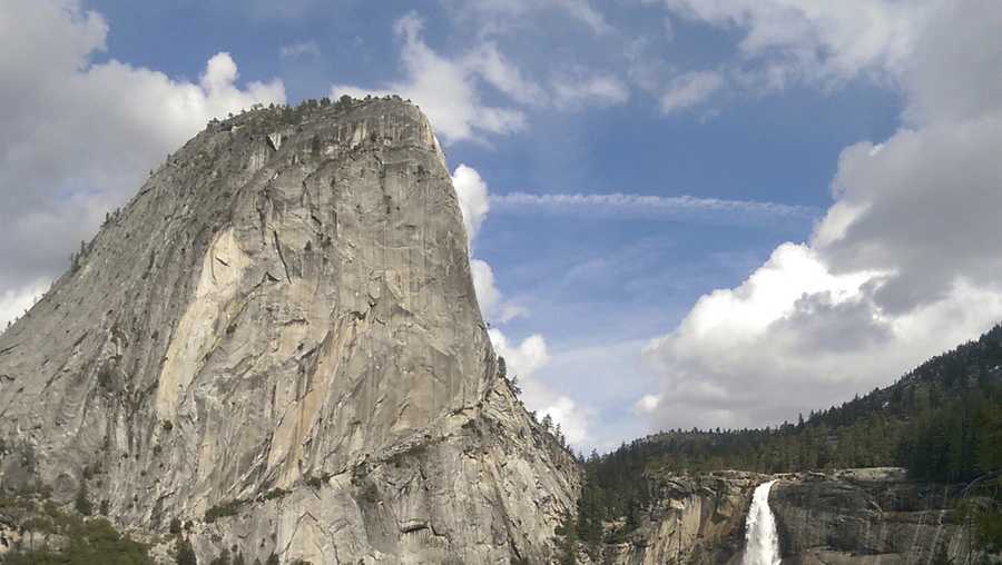 In this March 28, 2016, file photo provided by the National Park Service, water flows over the Nevada Fall near Liberty Cap as seen from the John Muir Trail in Yosemite National Park, Calif.