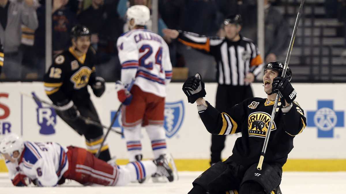Boston Bruins defenseman Zdeno Chara, of Slovakia, waves alongside