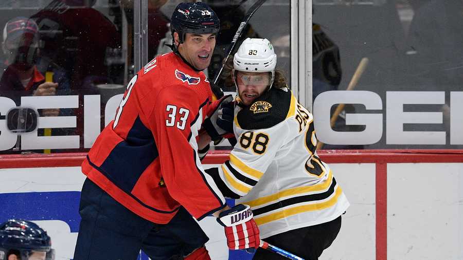Washington Capitals defenseman Zdeno Chara (33) and Boston Bruins right wing David Pastrnak (88) battle for position during the first period of an NHL hockey game, Saturday, Jan. 30, 2021, in Washington. (AP Photo)
