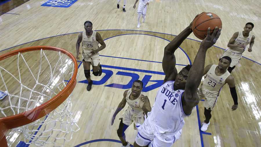 Duke's Zion Williamson (1) goes up to dunk against Florida State during the first half of the NCAA college basketball championship game of the Atlantic Coast Conference tournament in Charlotte, N.C., Saturday, March 16, 2019.