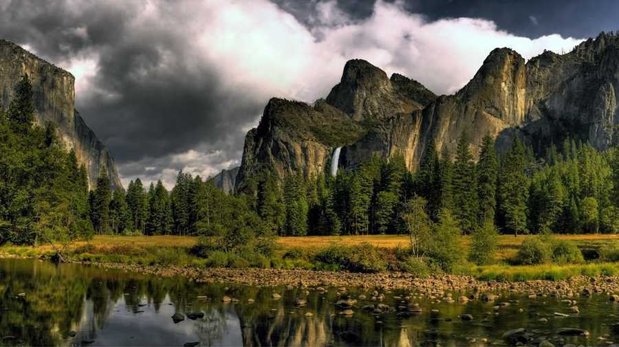 The Yosemite Valley is located in California's Sierra Nevada mountain range and was once home to Native American people. Yosemite saw a boom in visitors in 1849 during the gold rush era.