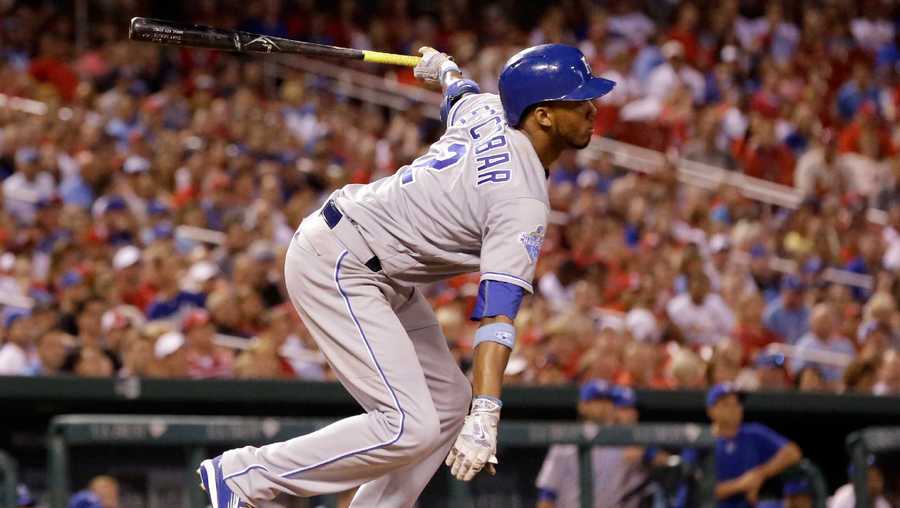 Kansas City Royals' Alcides Escobar follows through on a sacrifice fly to score Christian Colon during the eighth inning of a baseball game against the St. Louis Cardinals Wednesday, June 29, 2016, in St. Louis. (AP Photo/Jeff Roberson)