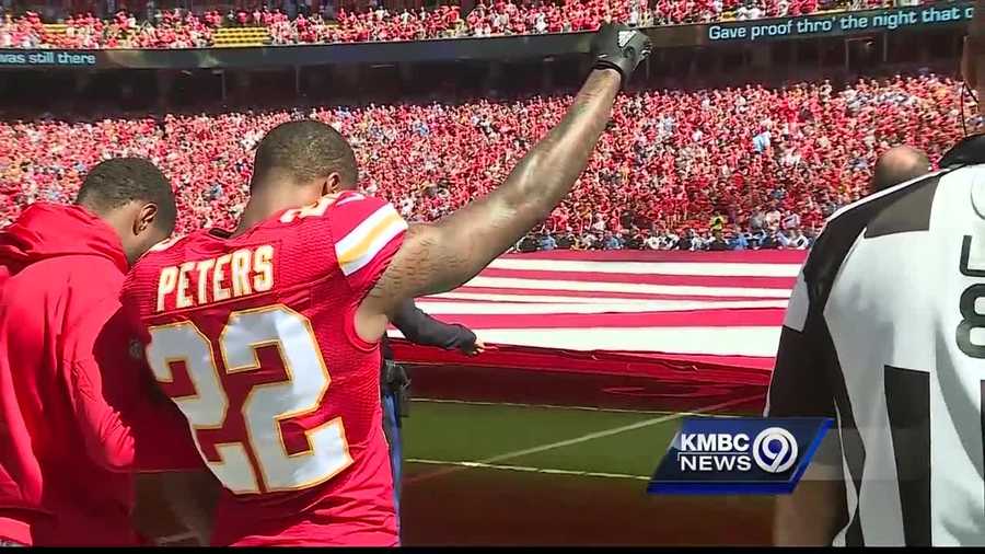 Chiefs players locked arms in a show of solidarity during Sunday's national anthem, but defensive standout Marcus Peters also stood with a raised fist.