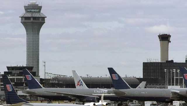 A United Airlines jet taxis along a runway at O'Hare International Airport in Chicago.