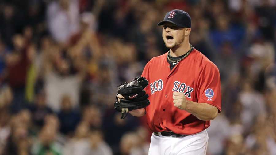 Boston Red Sox starting pitcher Jon Lester pumps his fist and yells after getting Toronto Blue Jays' Jose Reyes to strike out ending the top half of the seventh inning of a baseball game at Fenway Park, Friday, Sept. 20, 2013.