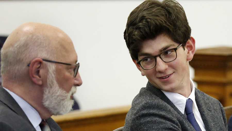Owen Labrie, right, smiles as he talks with his lawyer J.W. Carney before being sentenced in Merrimack County Superior Court, Thursday Oct. 29, 2015, in Concord, N.H.