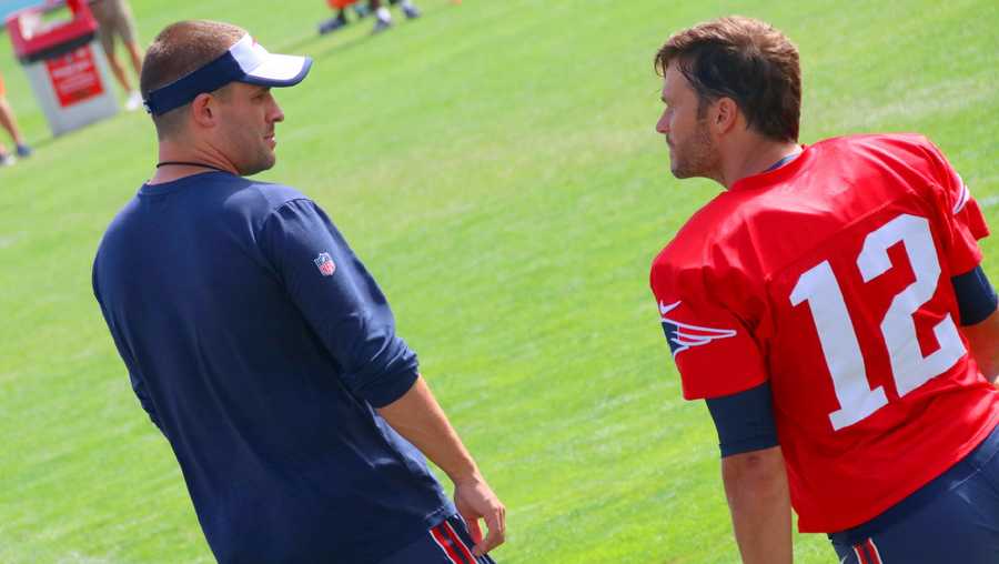 Tom Brady seems like he's always talking with one of the coaches or players. Here, he chats with offensive coordinator Josh McDaniels.