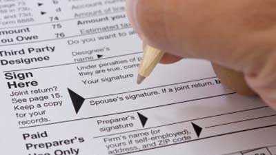 Signing tax form, taxes, signature, money