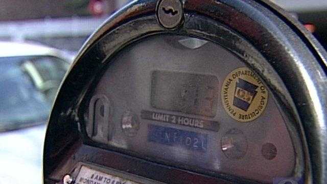 Scammers are covering parking meter QR codes with their own