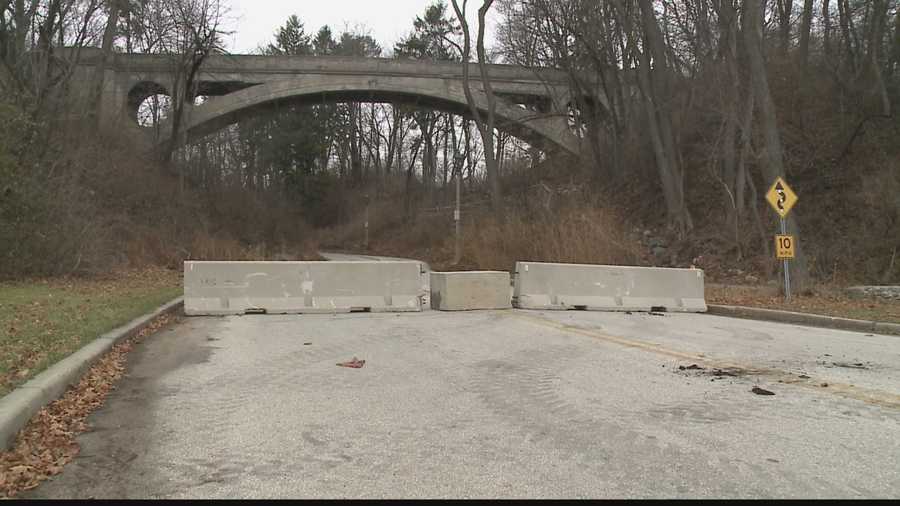 Chunks of debris from the foot bridge in Lake Park has forced park officials to barricade the road, making it an inconvenience for drivers and park goers.