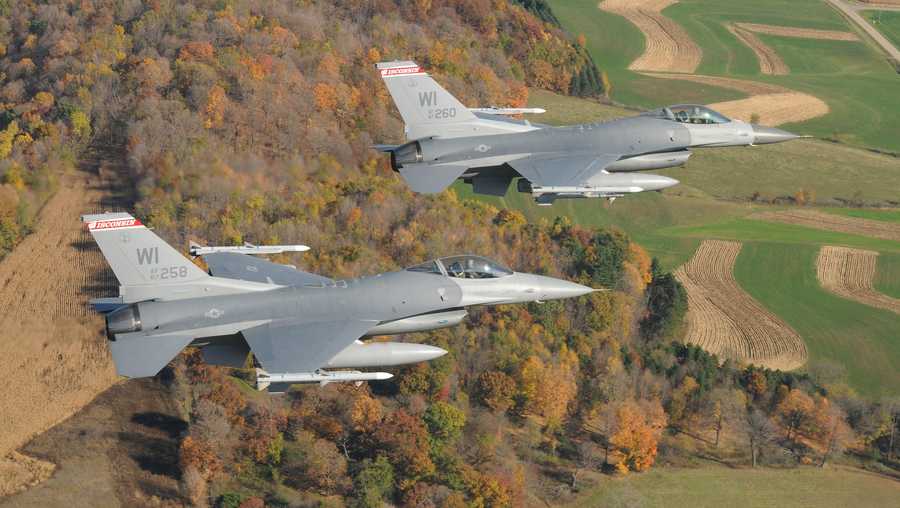 a photo shows two f 16 fighter jets from the 115th fighter wing in madison
