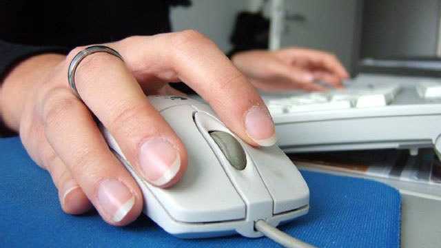 Hand on computer mouse internet web generic