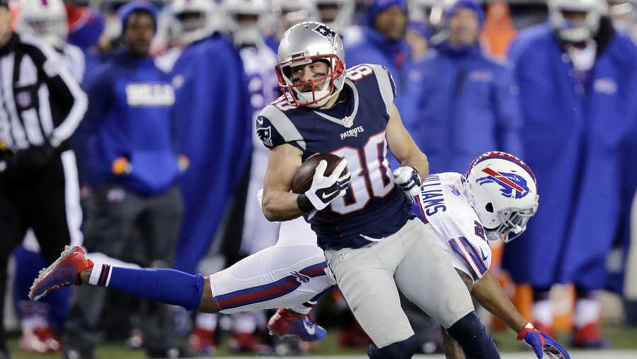 New England Patriots wide receiver Danny Amendola (80) runs from Buffalo Bills safety Duke Williams (27) after catching a pass in the second half of an NFL football game, Monday, Nov. 23, 2015, in Foxborough, Mass.