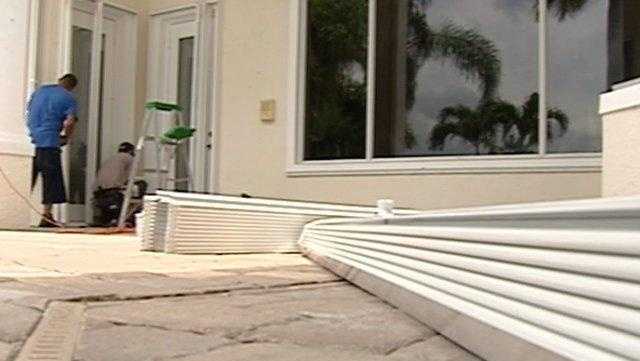 Storm shutters are installed at this Palm Beach Gardens home on the first day of the 2010 Atlantic hurricane season.