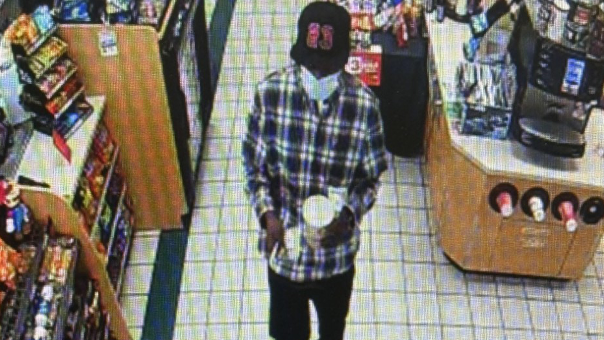 Masked individual robs convenience store; search for suspect underway
