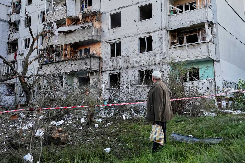 Russian attack on Ukraine kills at least 11 and traps others in damaged buildings