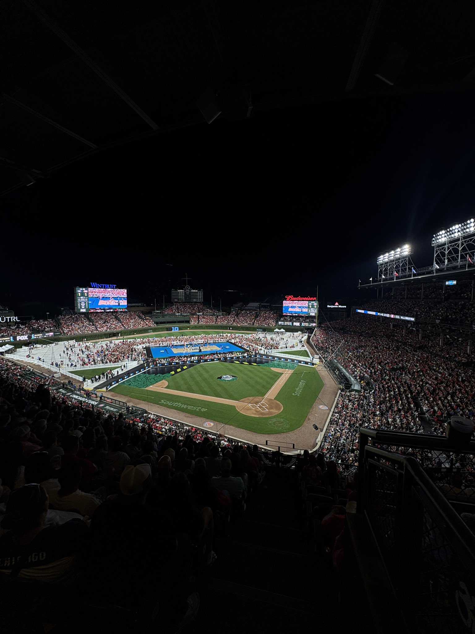 Wrigley Field suspends Husker-Tiger volleyball match due to moisture on the court