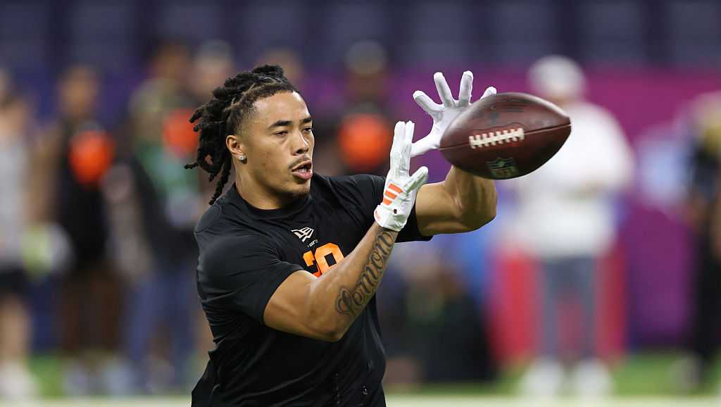 The Philadelphia Eagles trade up with the Dallas Cowboys to select wide receiver Makai Lemon