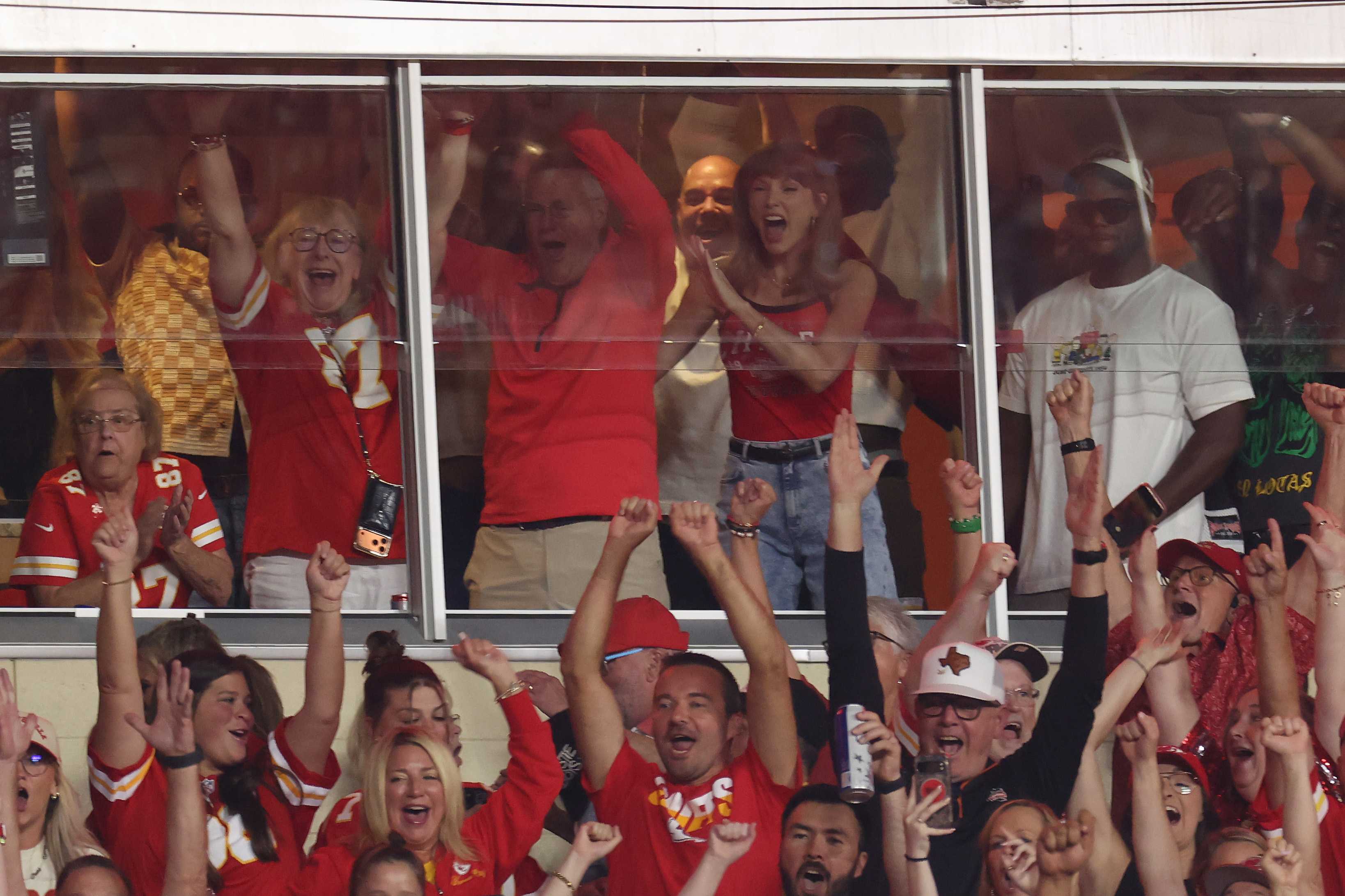 Taylor Swift shows off her ring and yells 'my husband!' as Travis Kelce scores touchdown