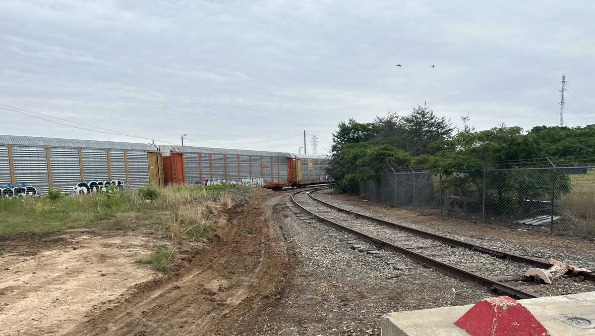 Body found in burning car on railroad tracks