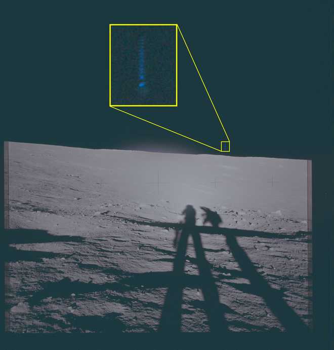 This archival photograph depicts the lunar surface as viewed from the landing site of Apollo 12. This image features a highlighted area of interest slightly to the right of the vertical axis of the frame, above the horizon, in which unidentified phenomena are visible.