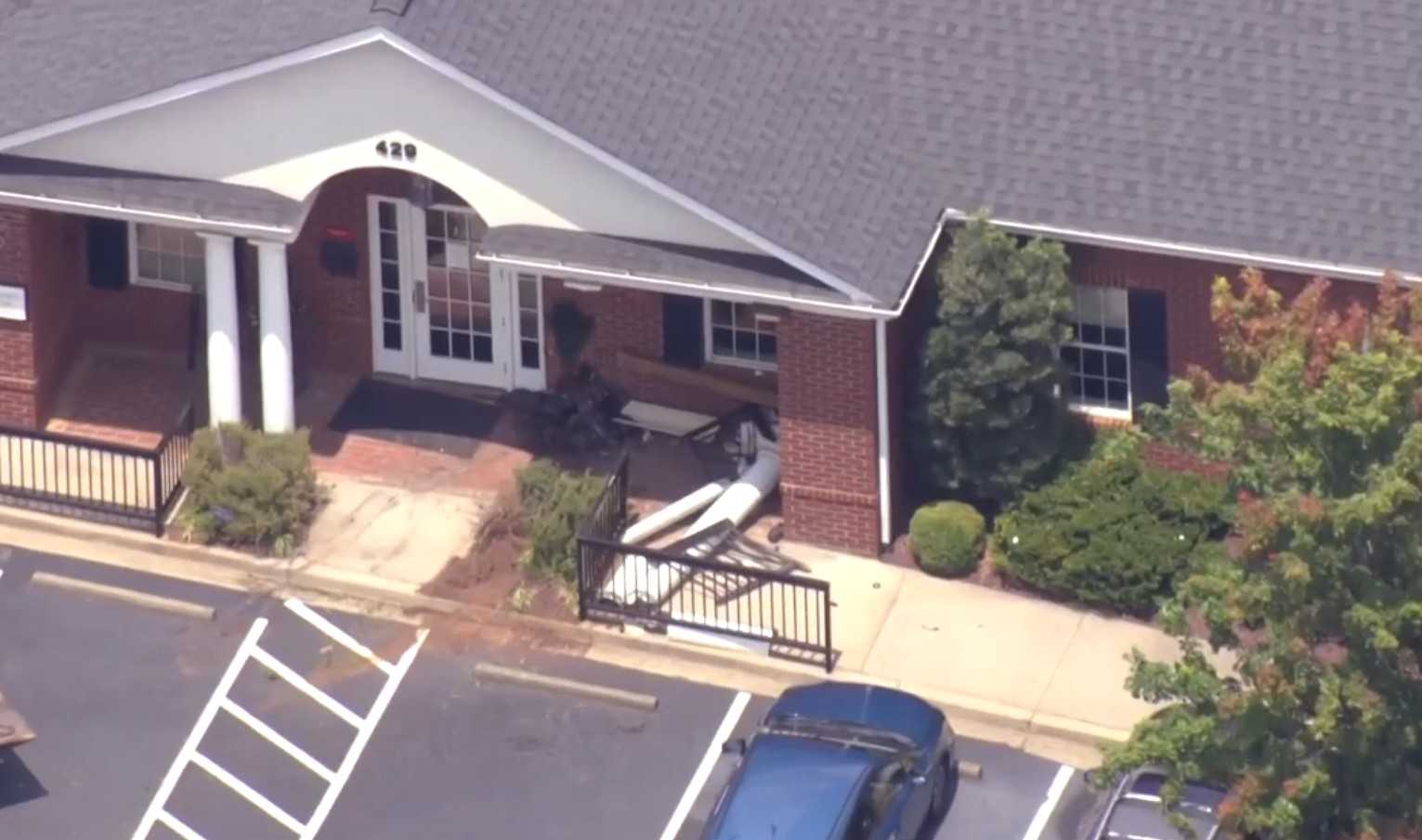 Car hits front of building in Greenville