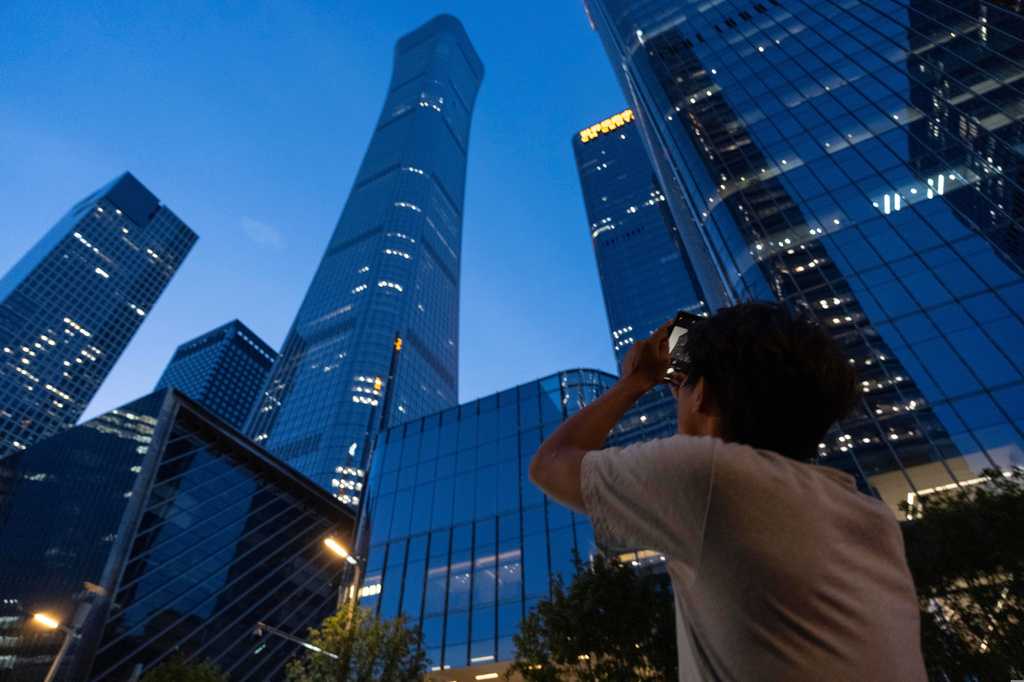 Small plane crashes into Beijing skyscraper, killing the pilot and injuring 13