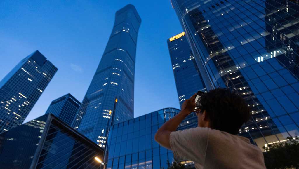 Small plane crashes into Beijing skyscraper, killing the pilot and injuring 13