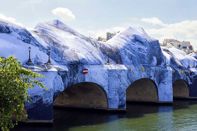 PARIS, FRANCE - MAY 21: General view of the JR artwork &amp;quot;La Caverne du Pont Neuf&amp;quot; under construction, at the bridge &amp;quot;Pont Neuf&amp;quot; above the Seine river &amp;quot;La Caverne du Pont Neuf&amp;quot; will be open to public from June 6 to 28, 2026. This work pays tribute to Christo and Jeanne-Claude&amp;apos;s The Pont Neuf Wrapped, which celebrated its 40th anniversary in 2025.on May 15, 2026 in Paris, France. &amp;quot;La Caverne du Pont Neuf&amp;quot; will be open to public from June 6 to 28, 2026. This work pays tribute to Christo and Jeanne-Claude&amp;apos;s The Pont Neuf Wrapped, which celebrated its 40th anniversary in 2025 on May 21, 2026 in Paris, France. (Photo by Luc Castel/Getty Images)