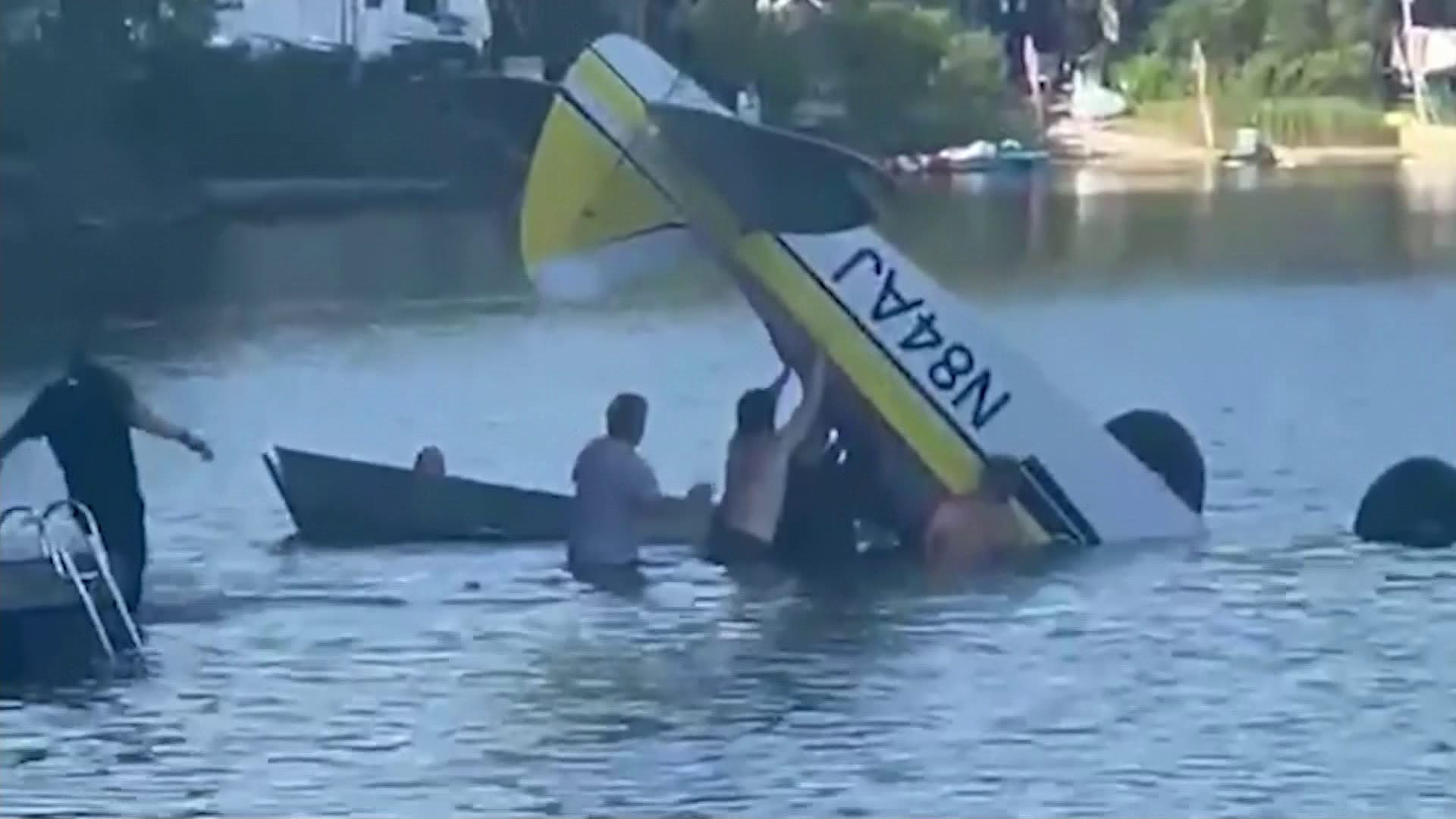 Pilot who died after bystanders tried to free him from submerged cockpit identified