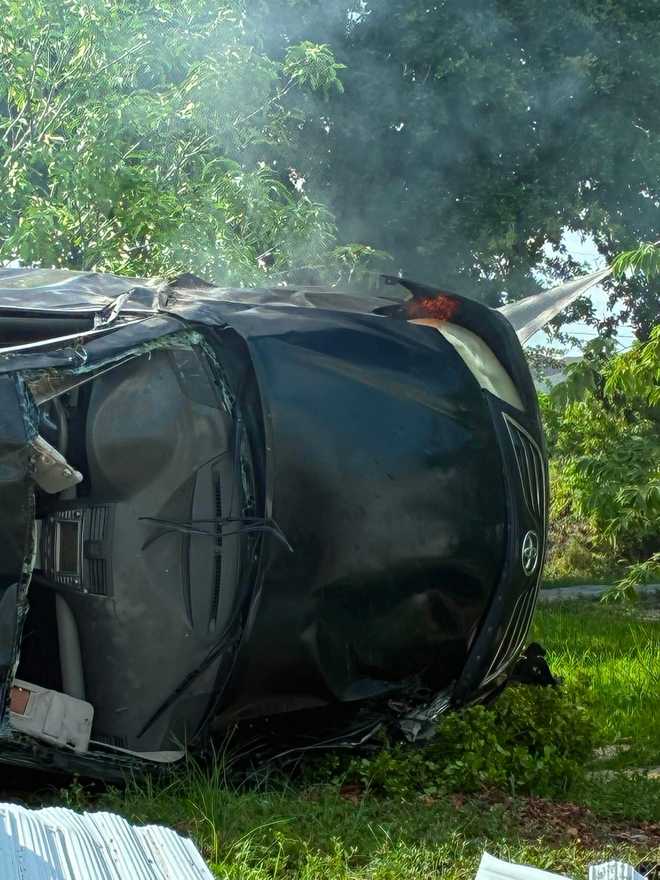 At least 1 injured after car rolls over, crashes into fence near Cape Coral home