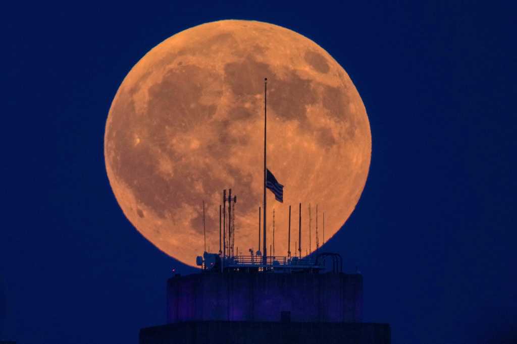 Partial lunar eclipse stuns skywatchers with an 'almost blood moon' as 96% of the moon passes through Earth's umbra; photographers capture stunning views worldwide