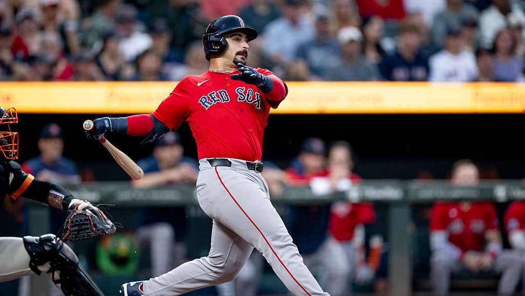 Boston Red Sox players and Baltimore Orioles players confronting each other near second base during a tense eighth-inning brawl in 2026