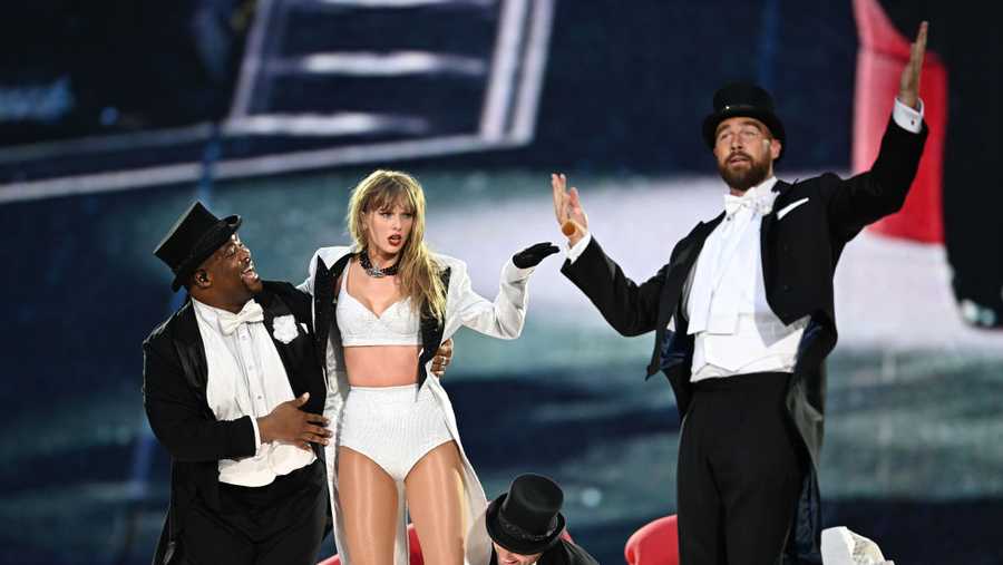LONDON, ENGLAND - JUNE 23: (EDITORIAL USE ONLY. NO STANDALONE PUBLICATION USE (NO SPECIAL INTEREST OR SINGLE ARTIST PUBLICATION USE; NO BOOK USE)) EXCLUSIVE ACCESS. Taylor Swift is joined on stage by Travis Kelce (R), during "Taylor Swift | The Eras Tour" at Wembley Stadium on June 23, 2024 in London, England. (Photo by Gareth Cattermole/TAS24/Getty Images for TAS Rights Management )