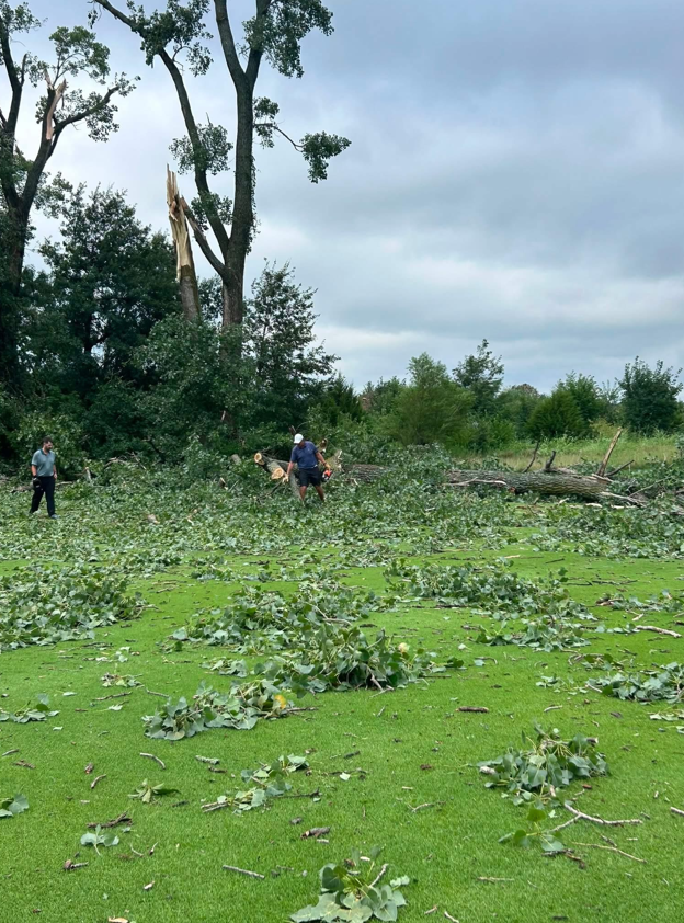 Leaves and tree limbs are shown scattered at Creekmoor Golf Course after a storm.