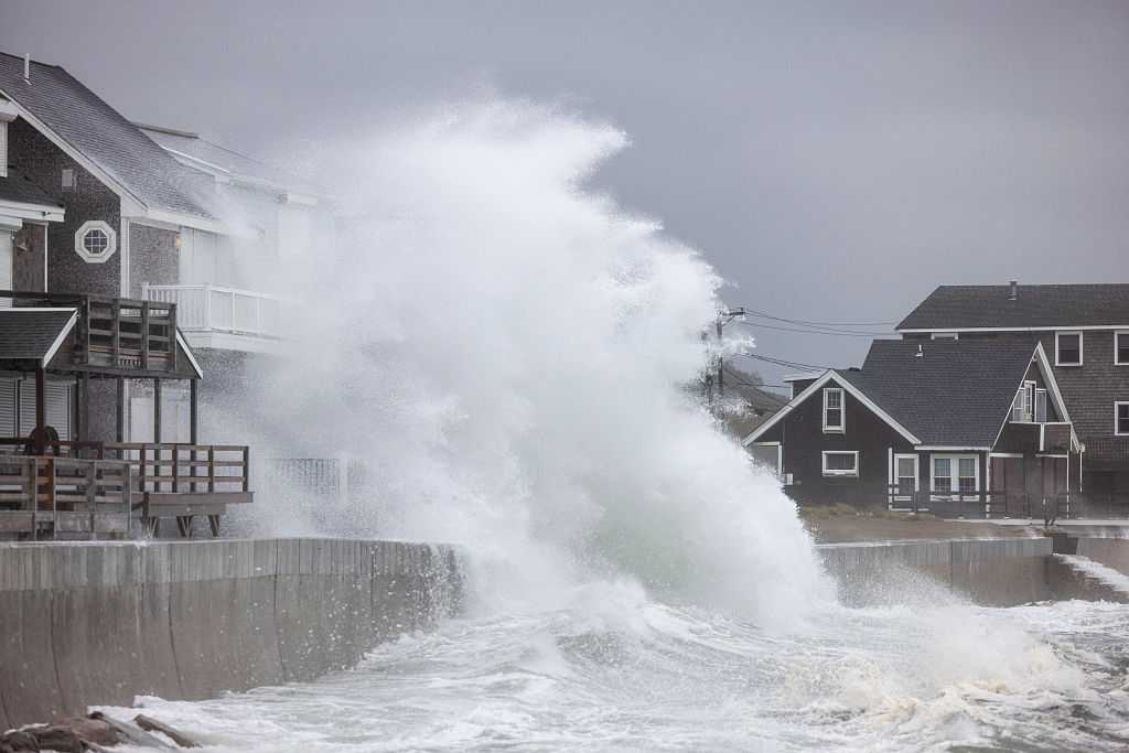 Powerful nor’easter floods leave over 130,000 without power as high tides threaten east coast