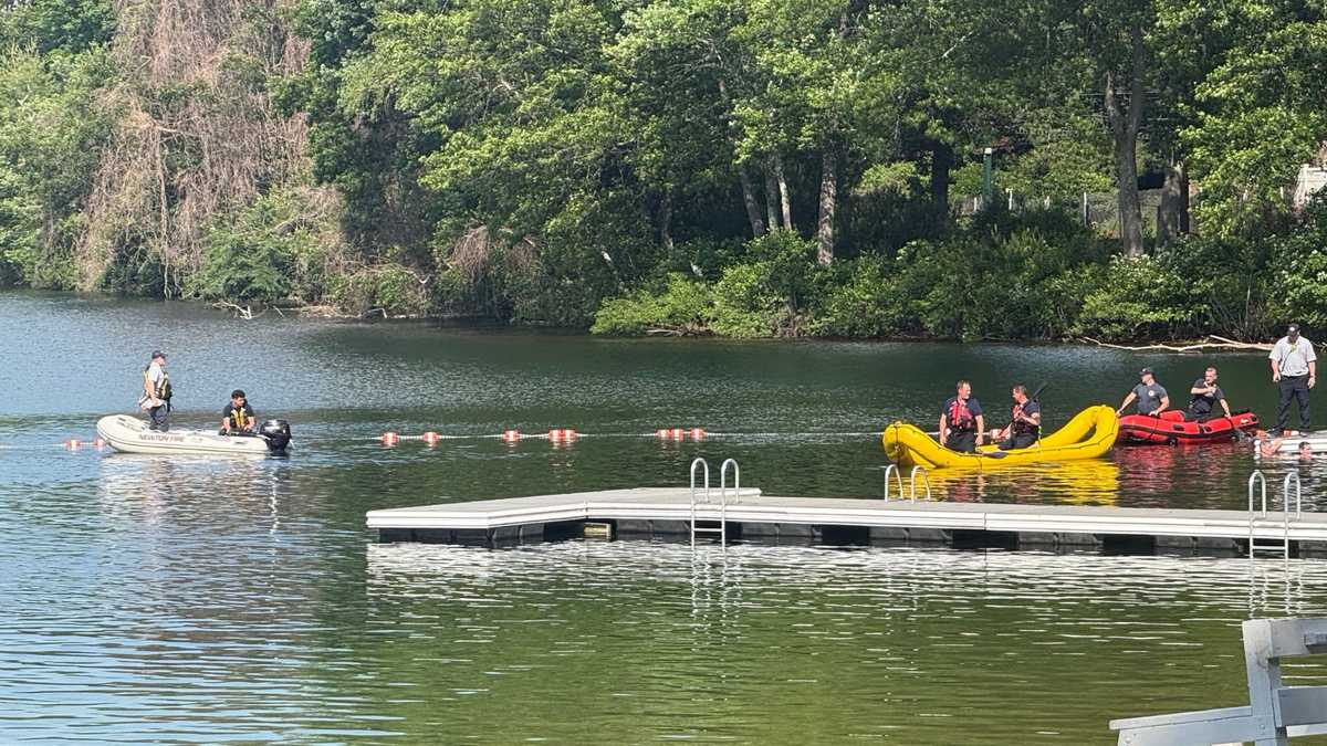Dive teams search Mass. lake after reported drowning
