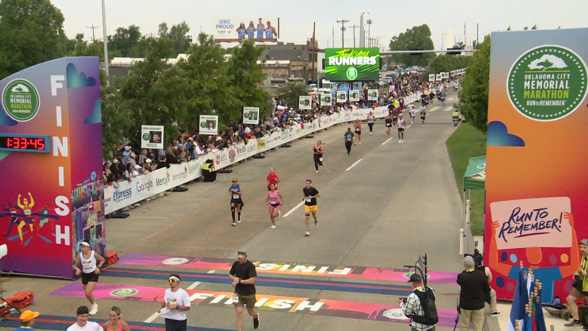 Who crossed the finish line first in the Oklahoma City Memorial Marathon?