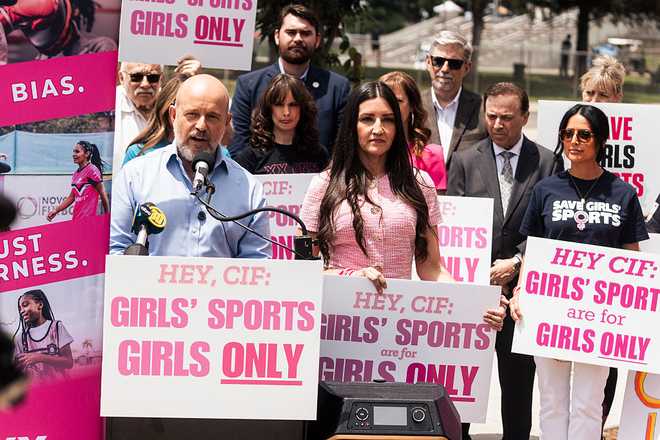 California gubernatorial candidate Steve Hilton, left, and California state superintendent candidate Sonja Shaw are seen during a news conference and protest against the participation of a transgender athlete in the 106th California Interscholastic Federation (CIF) State Track Field Championships outside Veterans Memorial Stadium in Clovis, Calif., Friday, May 29, 2026.
