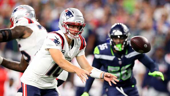 SEATTLE, WASHINGTON - SEPTEMBER 09: Drake Maye #10 of the New England Patriots flicks the ball against the Seattle Seahawks during the fourth quarter in the game at Lumen Field on September 09, 2026 in Seattle, Washington. (Photo by Steph Chambers/Ge