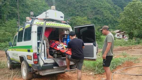 Rescuers evacuate the first of 5 villagers found trapped in Laos cave; 2 still missing