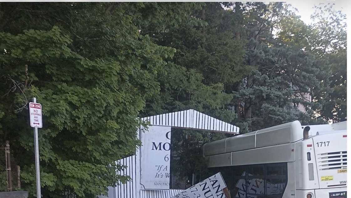 Driver, passenger injured when MBTA bus strikes fence, tree in Boston
