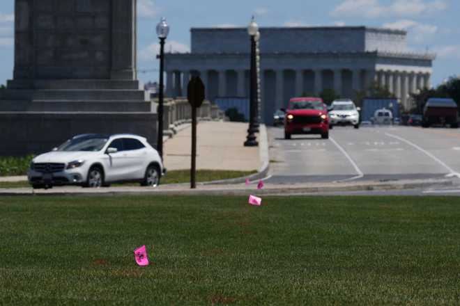 Flags placed by workers are pictured in the Memorial Circle, where President Donald Trump has proposed building an arch to commemorate the United States&amp;#39; 250th anniversary, Friday, May 15, 2026, in Washington.