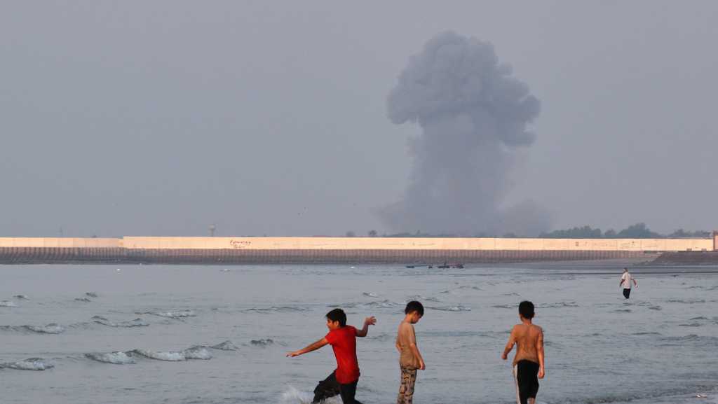 US strikes bridges and collapses a tower at a key port as its Iran marketing campaign expands